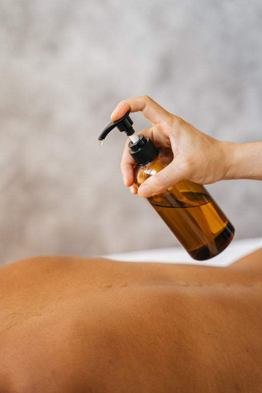 What role do essential oils play during a body massage?